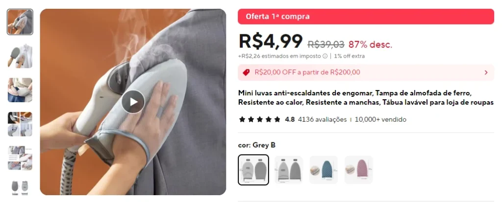 Ferro de passar em formato de luvas, passando uma camiseta.